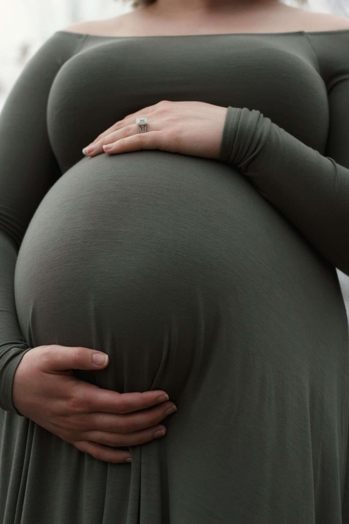 Woman holding pregnant belly