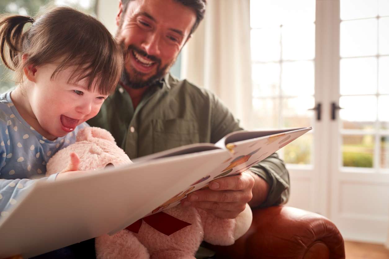 man reading to child