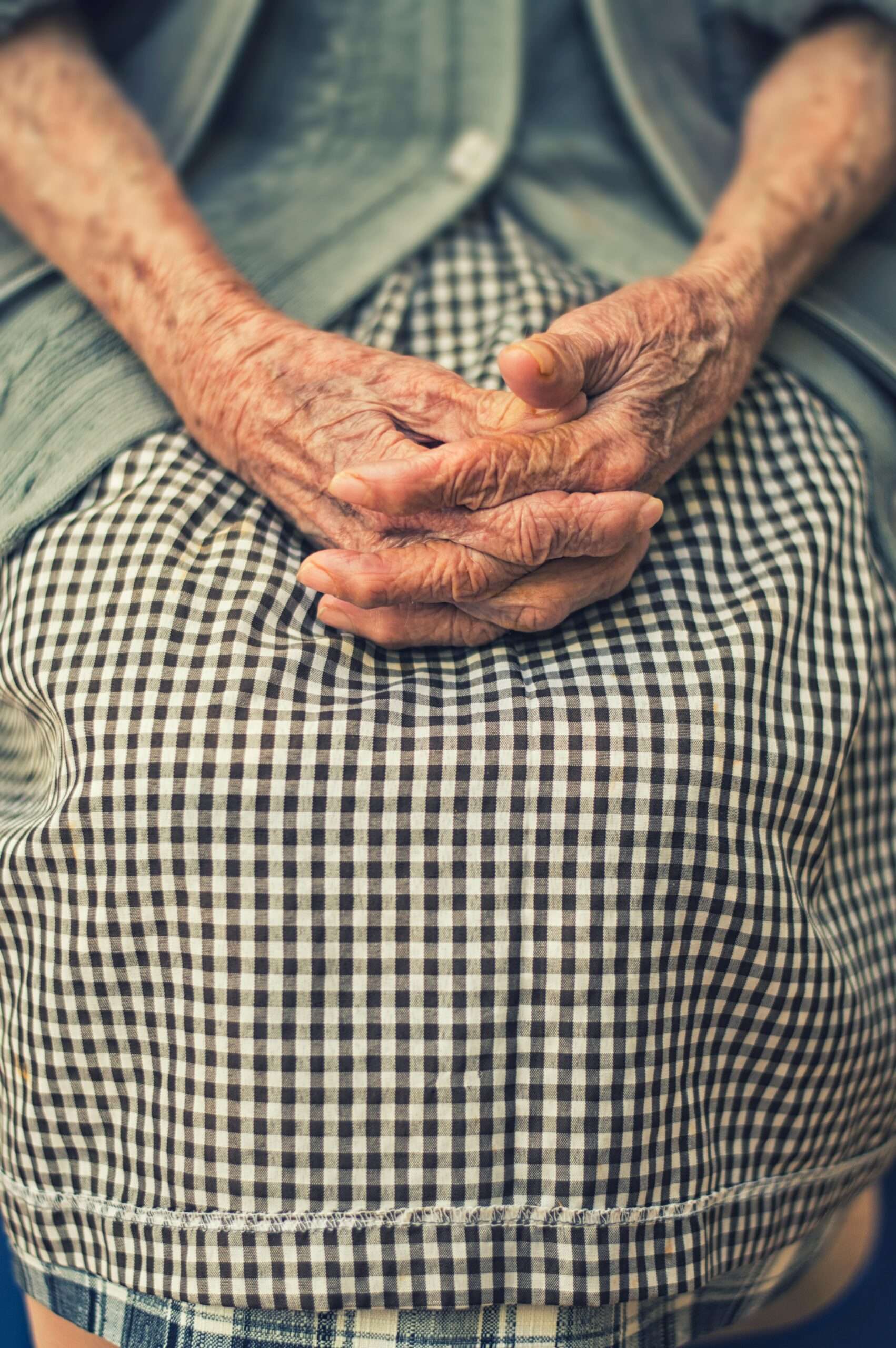 Elderly lady with folded hands